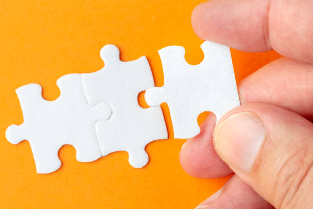 istock Creating or building own business concept. Puzzle piece, construction and development concept 1135954494