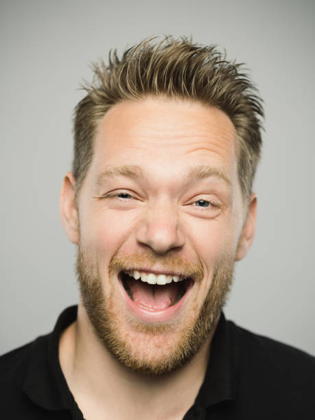 istock Portrait of real caucasian man shouting with excited expression 1135954690