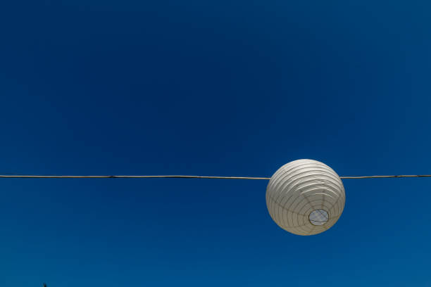 istock background with white paper lantern and blue sky 1135958667