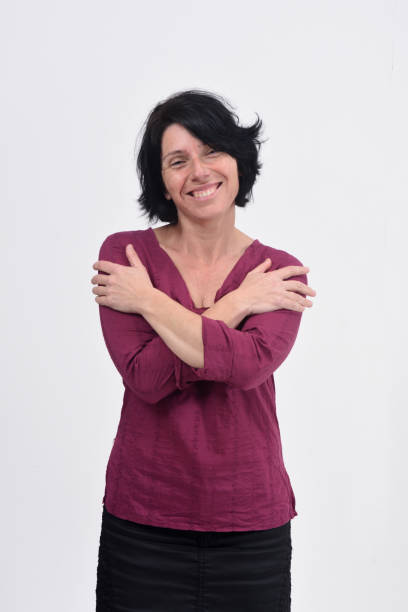 istock woman hugging on white background 1135958815