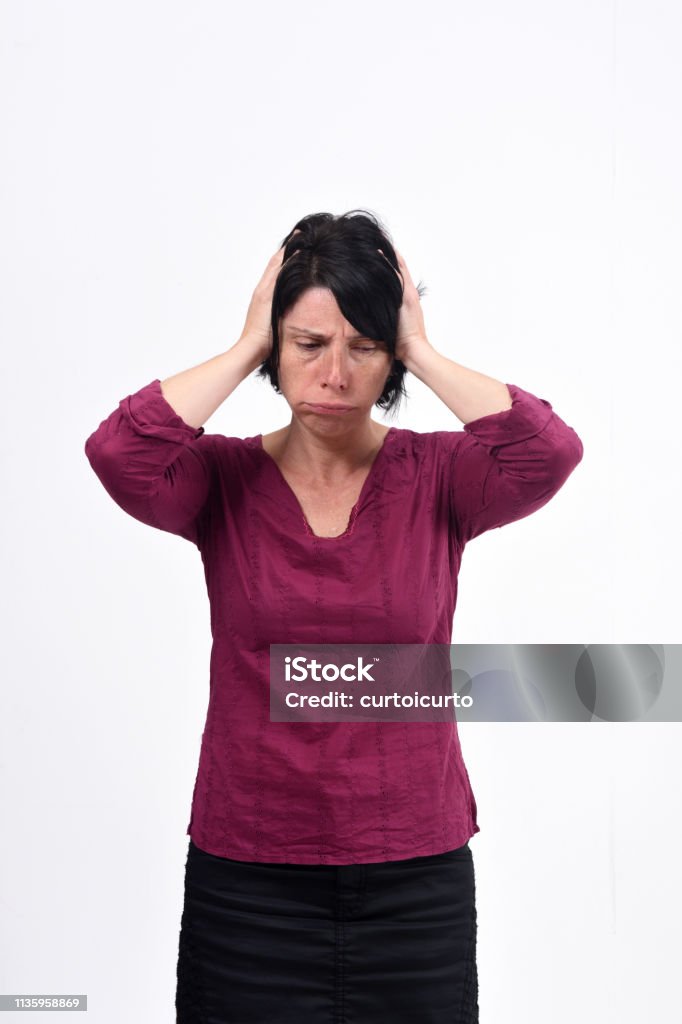 woman with headache on white background Adult Stock Photo