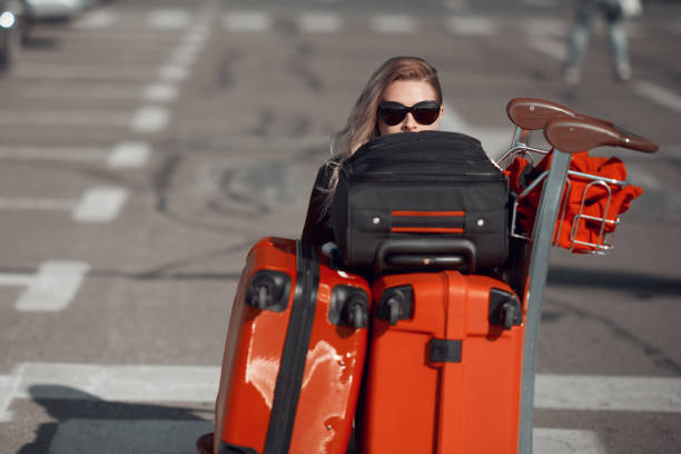 istock woman with her luggages 1135960069