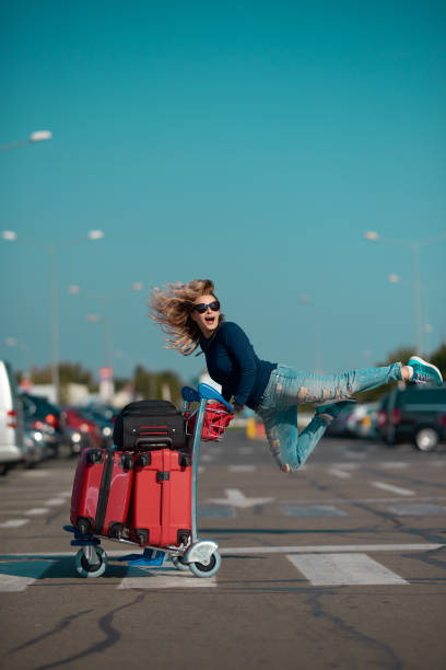 istock cheerful tourist woman 1135960075