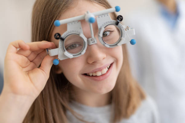 istock Cute little girl wearing optical trial frame 1135960488