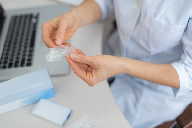 istock Ophthalmologist in white lab coat holding case with contact lens 1135960510