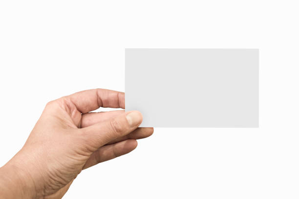 istock Hand holding a blank note or business card isolated on white background 1135960838