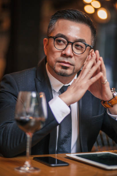 istock Handsome businessman sitting in restaurant 1135962907
