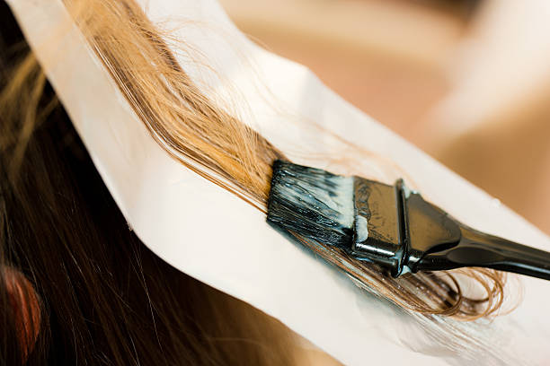 istock Woman getting her hair dyed color 113596366