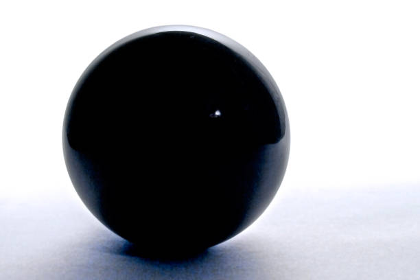 istock Still life - Black glass ball. 1135965847