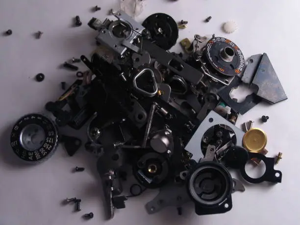 Disassembled Yashica SLR camera showcasing various pieces.