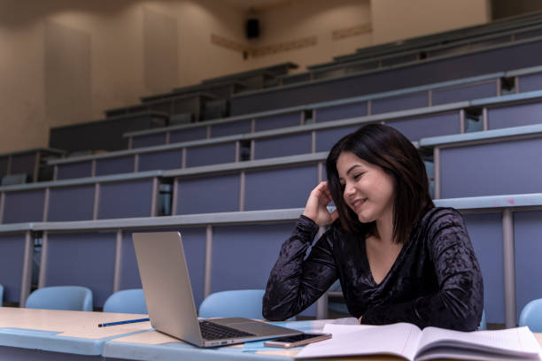 istock Woman working on laptop in a classroom 1135971040