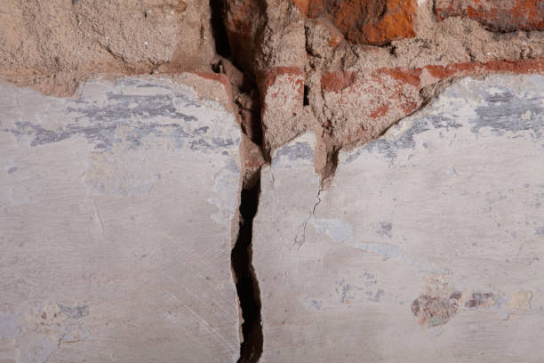 istock A piece of plaster on a brick wall 1135971639