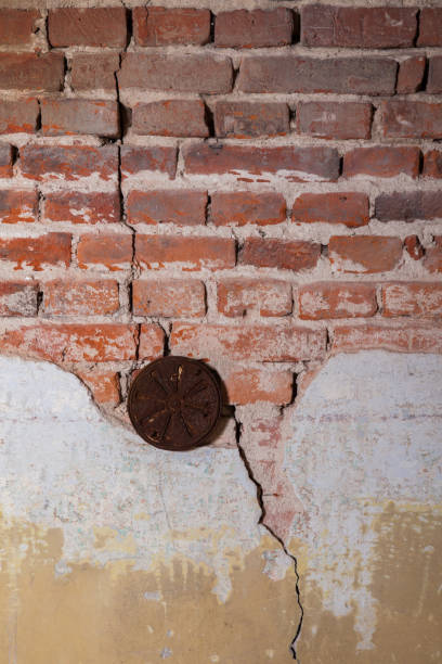 istock A piece of plaster on a brick wall 1135972225
