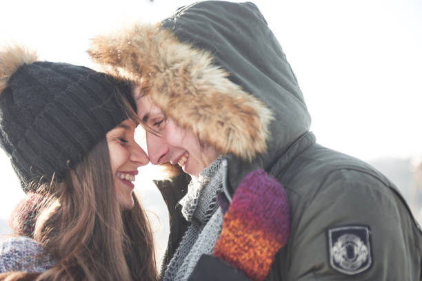 istock Cheerful young couple having fun in winter park 1135972467