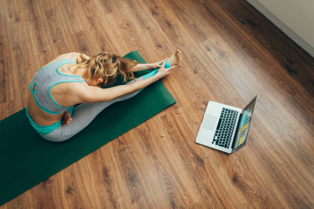 istock Woman practicing head to knee yoga pose 1135972908
