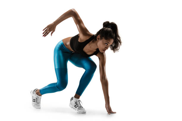 istock Young african woman running or jogging isolated on white studio background. 1135974361