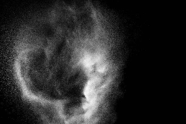 istock Bizarre forms of white powder explosion cloud against black background.White dust particles splash. 1135974574