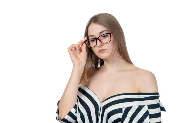 istock woman holds her glasses 1135974909