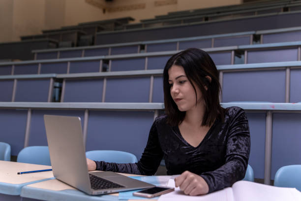 istock Woman working on laptop in a classroom 1135976662