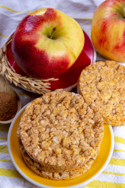 istock Round rice crackers made with apple and cinnamon, healthy snack for breakfast, lunch and school food 1135976792