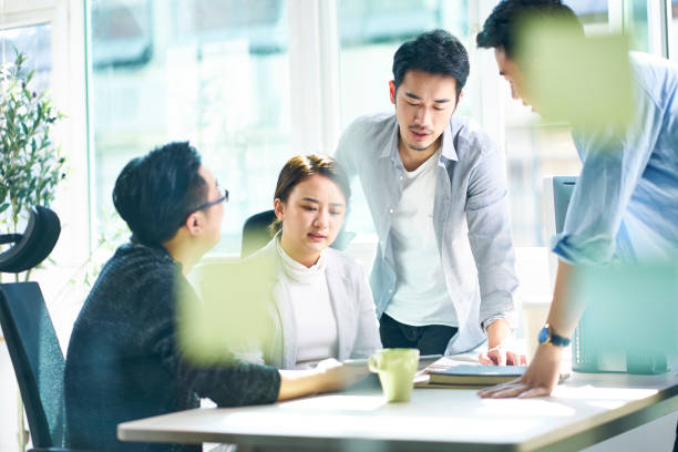 istock young asian colleagues meeting in office 1135978962