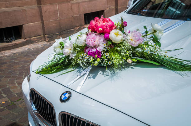 Wedding flowers on the car.
