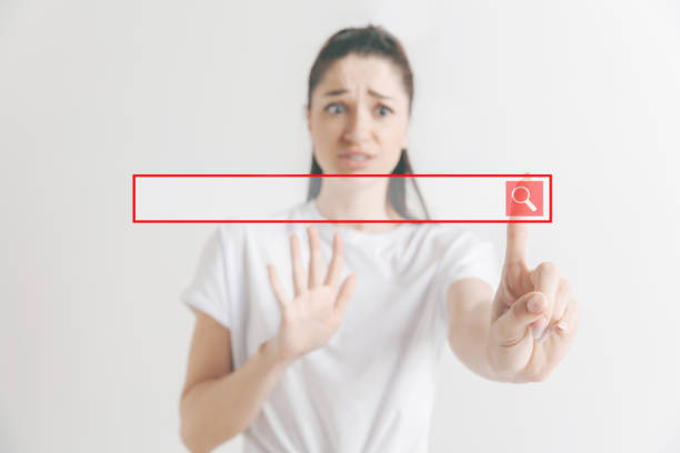 istock Woman's hand with finger on gray background 1135982386