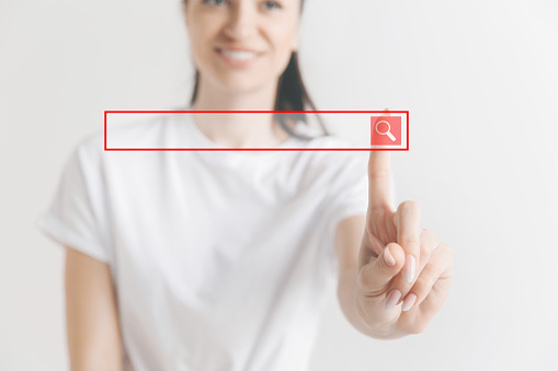 Businesswomans finger touching empty search bar, modern business background concept - can be used for insert text or pictures.