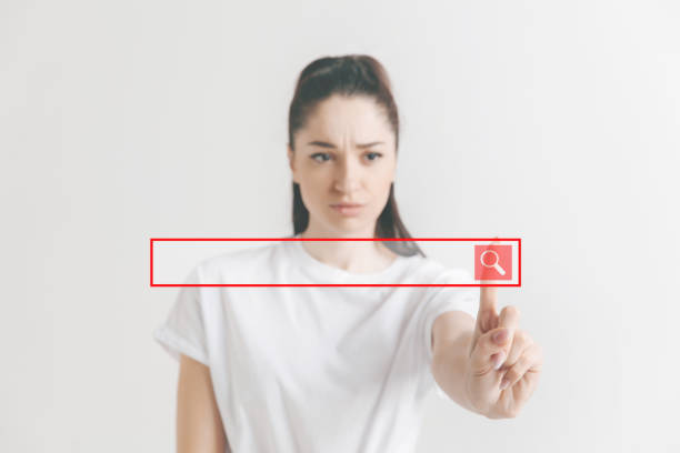 istock Woman's hand with finger on gray background 1135982395