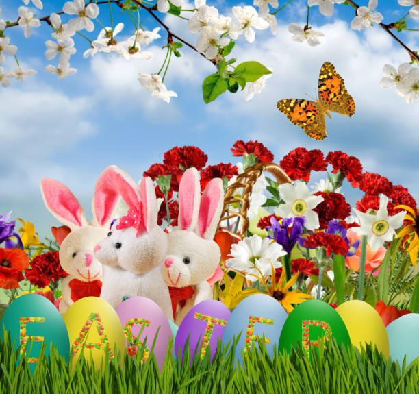 istock flowers,toy hares and easter eggs closeup 1135982546