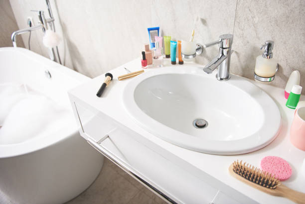 istock Top angle of white wash sink with items 1135983004