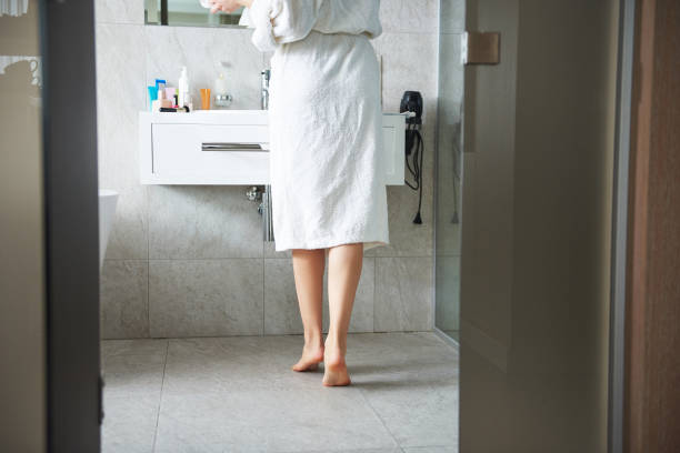 istock Waist down of young lady looking at mirror 1135983054