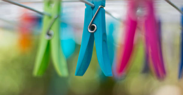 istock Colorful clothe pegs on a clothes line 1135984135