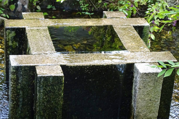 Stone wash basin found in Japanese gardens. Annex landscape thing of a Japanese garden. Washbowl for a tea-ceremony room