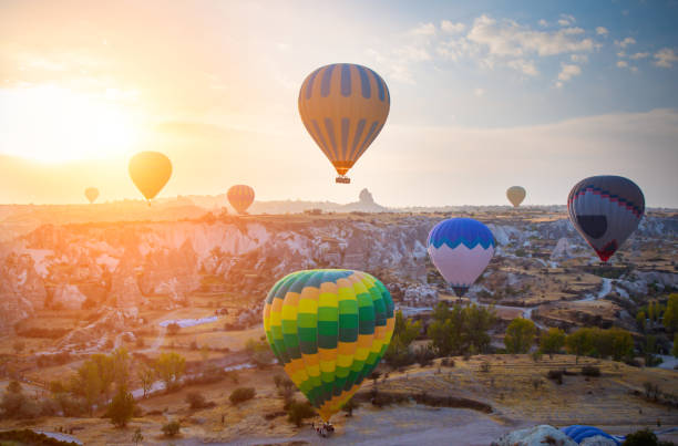istock Hot air balloon flying over Cappadocia, Turkey 1135984360