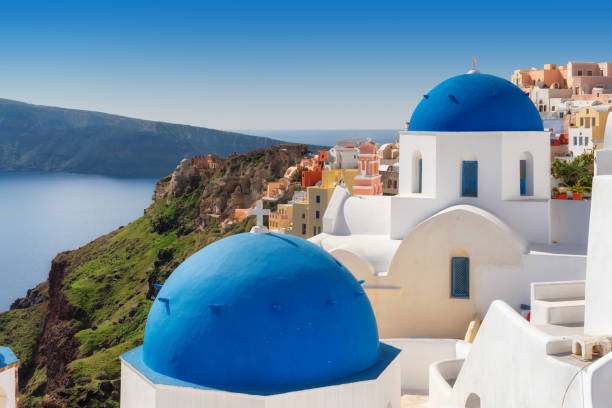 istock Blue domed churches on Santorini Greek Island 1135985888