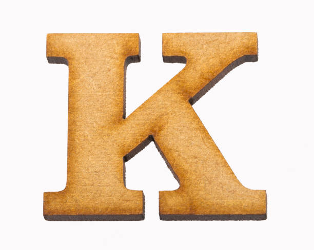 istock K, Wooden alphabet letter on white background 1135985978