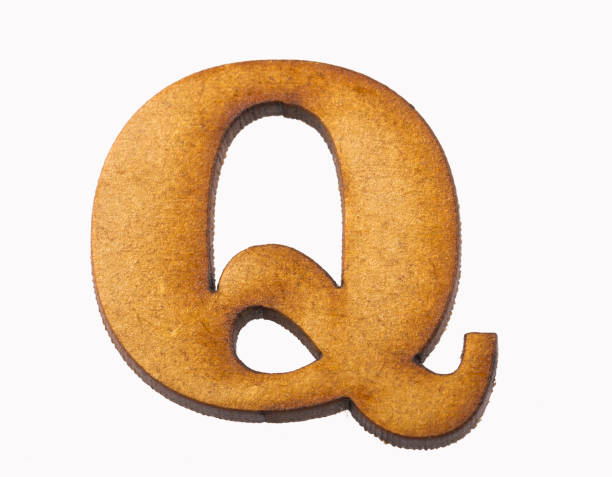 istock Q, Wooden alphabet letter on white background 1135987295