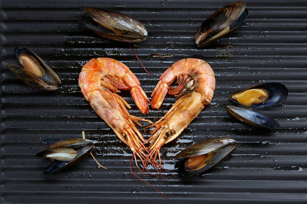 Heart-shaped prawns and mussels stock photo