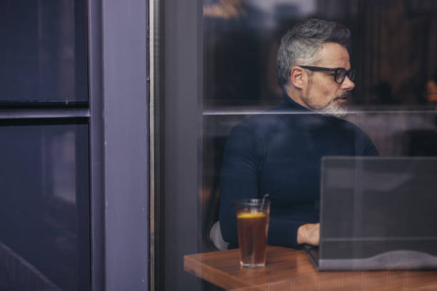 istock Modern gentleman sitting in cafe 1135987422