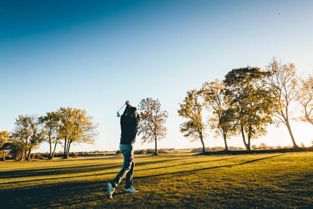 istock Golfer on the fairway in the late evening light. 1135988666