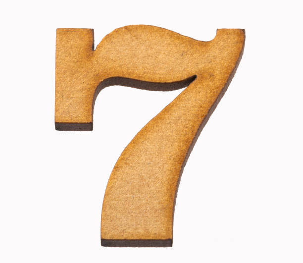 istock 7, Number in wood isolated on white background 1135988732