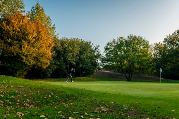 istock Golfer on the putting green. 1135988960