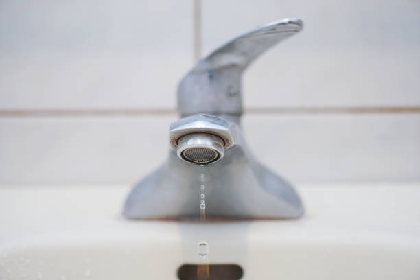 istock Faucet with water. In the bathroom. 1135989290