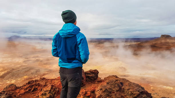 istock Iceland - Man and a geothermal region 1135991756