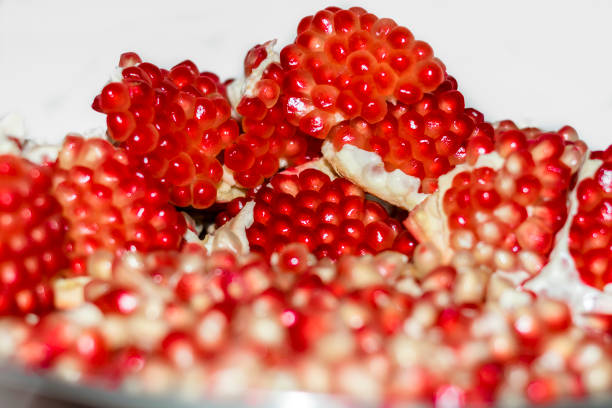 istock closeup of peeled pomegranate seeds with background 1135992085