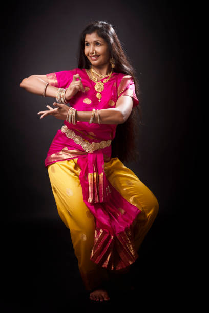 istock Young Indian lady performing classical dance of India 1135992203