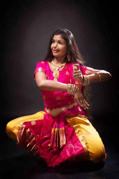 istock Young Indian lady performing classical dance of India 1135992345