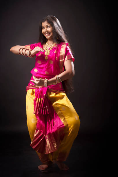 istock Young Indian lady performing classical dance of India 1135992385