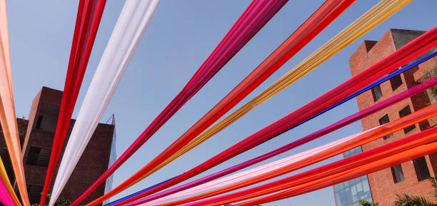 istock Colorful decoration with clothes on an building. 1135993384